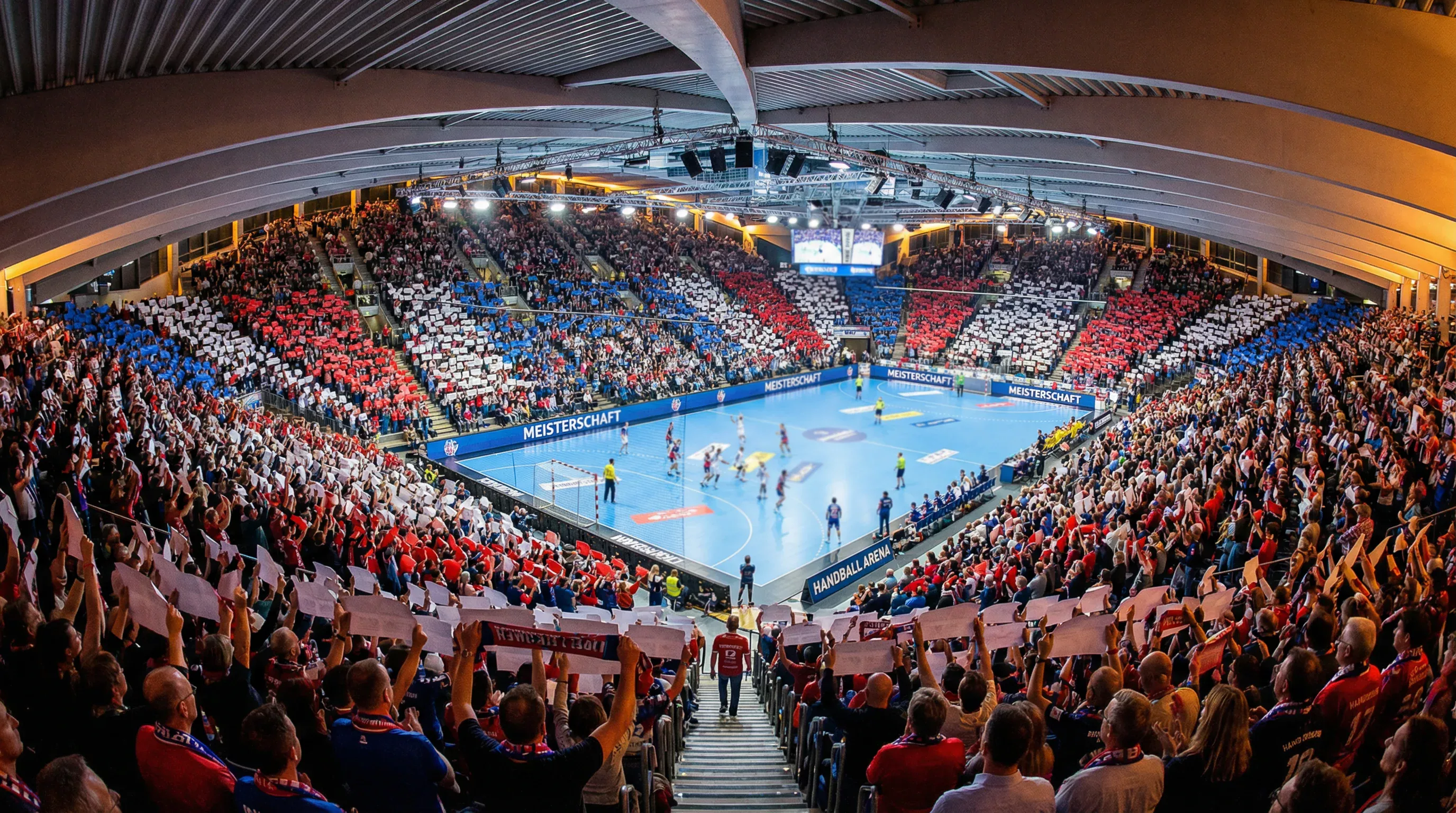 Volle Handballhalle bei einem HBL-Bundesligaspiel mit begeistertem Publikum